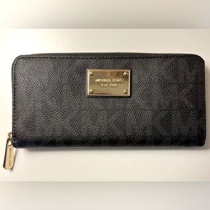 Large logo zip around wallet.